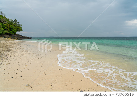 White sand beach in khang khao island, Ranong, Thailand in cloudy day. 73700519