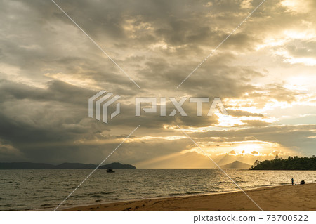 White sand beach in Phayam Island at sunset, Ranong, Thailand. White sand beach in Phayam Island at sunset, Ranong, Thailand. 73700522