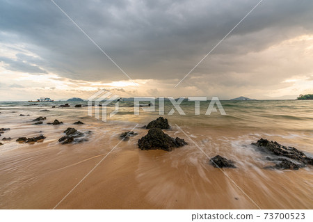 White sand beach in Phayam Island at sunset, Ranong, Thailand. White sand beach in Phayam Island at sunset, Ranong, Thailand. 73700523
