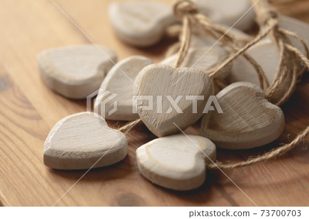 Hearts carved and made of chipped wood. Romantic image. Hearts carved and made of chipped wood. Romantic image. 73700703