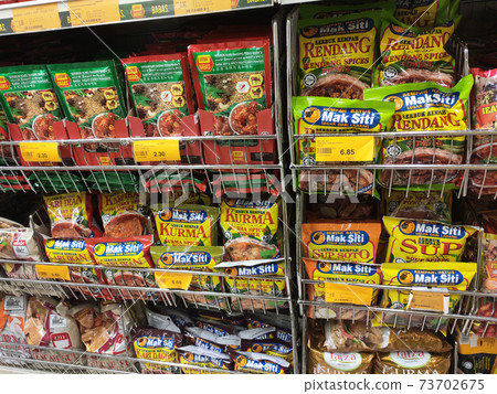 SEREMBAN, MALAYSIA -APRIL 5, 2020: Selected focused on the spices are sold in commercial packages and displayed on shelves in the supermarket. Sort by brand and type to make it easier to choose.  73702675
