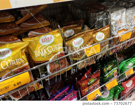 SEREMBAN, MALAYSIA -APRIL 5, 2020: Selected focused on the spices are sold in commercial packages and displayed on shelves in the supermarket. Sort by brand and type to make it easier to choose.  73702677