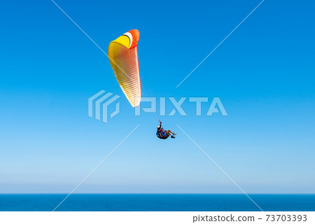 Bara glider flying in the blue sky in summer 73703393