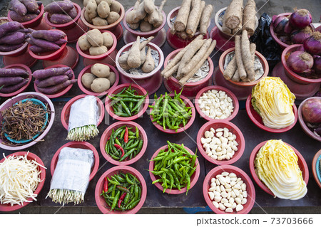 Vegetables placed for sale in baskets at the market Vegetables placed for sale in baskets at the market 73703666