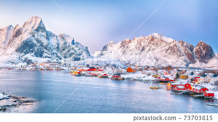 Dramatic evening cityscape of Reine town Dramatic evening cityscape of Reine town 73703815