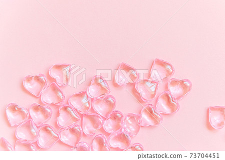 St. Valentine's Day concept. Many pink hearts isolated on pink pastel background. Postcard banner on valentines day. Love date lovesick wedding romance symbol. Top view flat lay, copy space 73704451