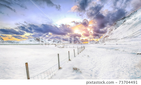 Fabulous winter scenery with Haukland beach during sunset and snowy  mountain peaks near Leknes. 73704491