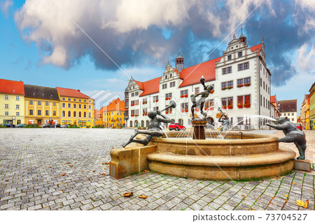 Splendid autumn view of Torgau Rathaus and famous fountain. 73704527