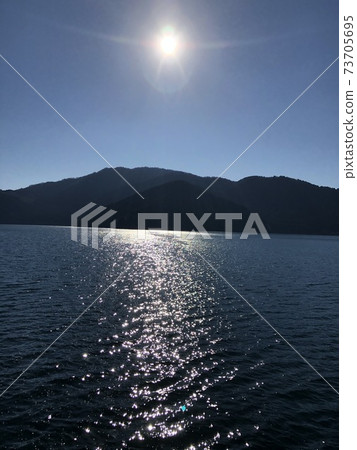 The surface of the shining Lake Ashi The surface of the shining Lake Ashi 73705695
