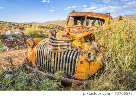 old rusty towing truck at Colorado foothills old rusty towing truck at Colorado foothills 73706573