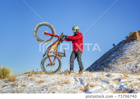 fat bike riding in winter Colorado landscape 73706740