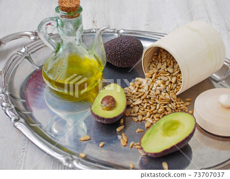 Natural source of vitamin E - sunflower seeds, olives, avocado, vegetable oil 73707037
