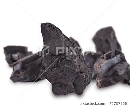 a big lumps of coal isolated on white background a big lumps of coal isolated on white background 73707366
