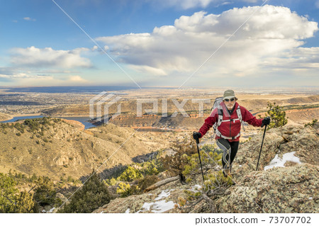 mature backpacker on a mountain ridge mature backpacker on a mountain ridge 73707702
