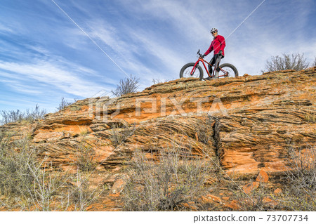 male cyclist riding fat bike 73707734