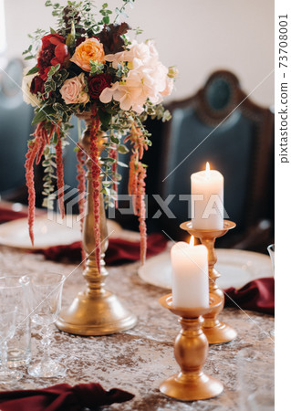 wedding table decoration with flowers on the table in the castle, table decor for dinner by candlelight.Dinner with candles 73708001