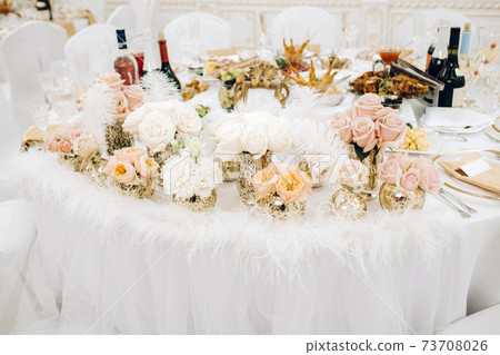wedding table decoration with flowers on the table in the castle, table decor for dinner by candlelight.Dinner with candles 73708026