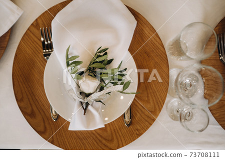 Dishes on the wedding table, decor of the dining table for the holiday 73708111