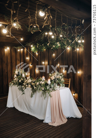 wedding table decoration with flowers on the table in the castle, table decor for dinner by candlelight.Dinner with candles 73708115