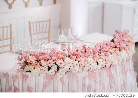 wedding table decoration with flowers on the table in the castle, table decor for dinner by candlelight.Dinner with candles 73708129