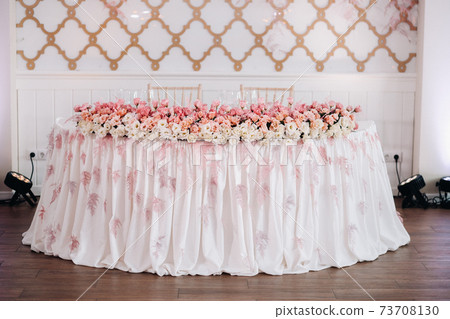 wedding table decoration with flowers on the table in the castle, table decor for dinner by candlelight.Dinner with candles 73708130