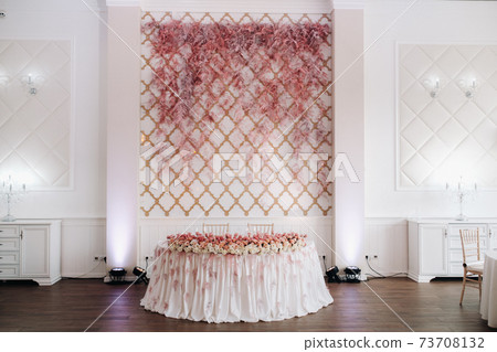 wedding table decoration with flowers on the table in the castle, table decor for dinner by candlelight.Dinner with candles 73708132