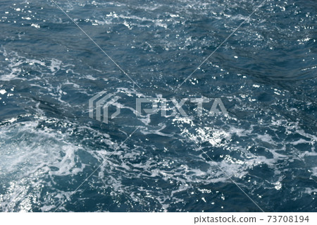 Sea water surface and splash, Dark blue ocean water for natural background 73708194