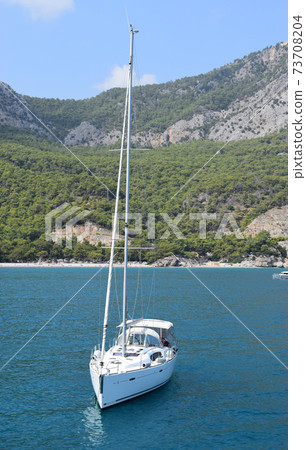 Sailboat sailing in Mediterranean sea near the Turtle Island Sailboat sailing in Mediterranean sea near the Turtle Island 73708204