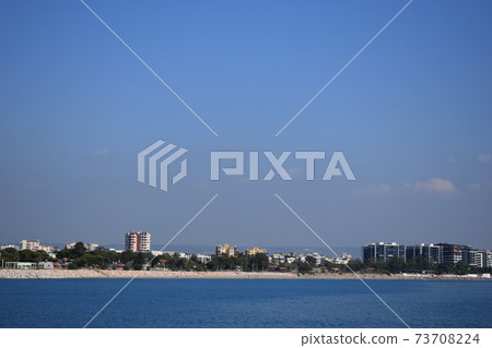 Antalya coastline. Beach near the port. Antalya coastline. Beach near the port. 73708224