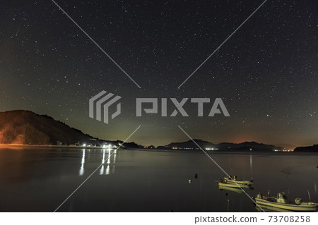 Winter starscape in Setouchi Scorpio rising in the sky of the fishing port 73708258