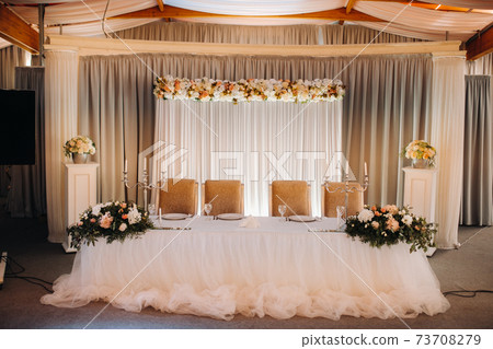 wedding table decoration with flowers on the table in the castle, table decor for dinner by candlelight.Dinner with candles 73708279