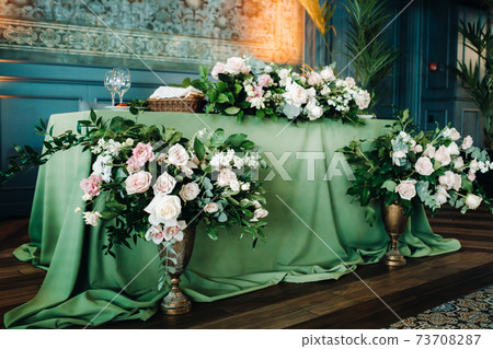 wedding table decoration with flowers on the table in the castle, table decor for dinner by candlelight.Dinner with candles 73708287