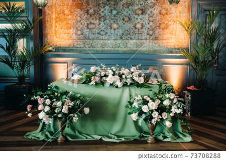 wedding table decoration with flowers on the table in the castle, table decor for dinner by candlelight.Dinner with candles 73708288