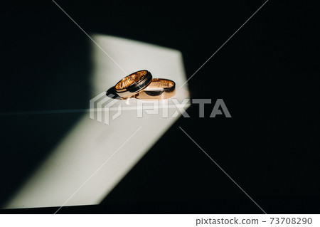 Close-up of two gold wedding rings for a wedding 73708290