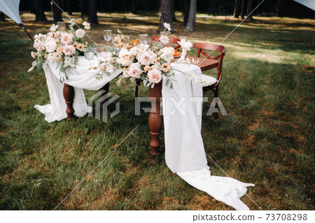 wedding table decoration with flowers on the table, dinner table decor 73708298