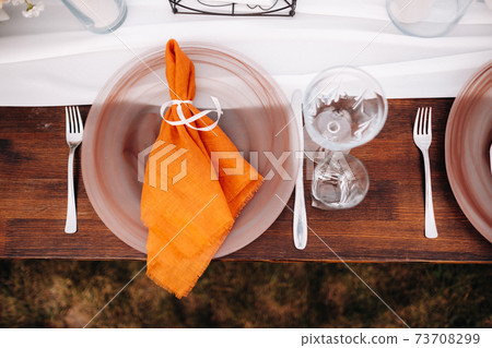 Dishes on the wedding table, decor of the dining table for the holiday 73708299