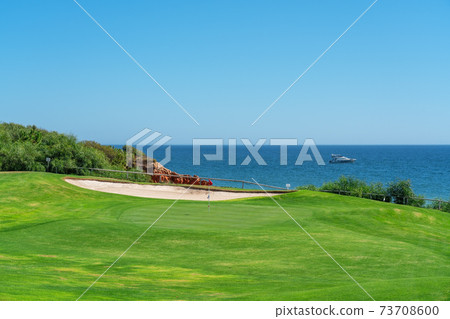 Resort luxury beaches, golf courses with palm trees, overlooking the sea for tourists to relax. Portugal algarve 73708600