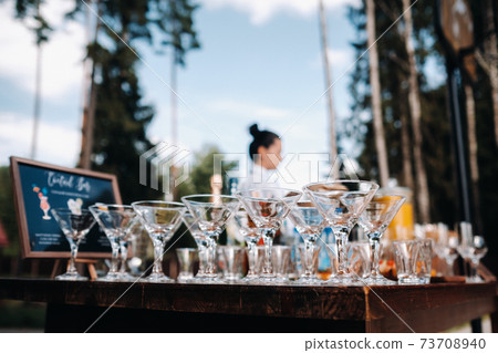 A lot of empty glasses are on the table for the beginning of the holiday 73708940