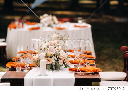 wedding table decoration with flowers on the table, dinner table decor 73708942