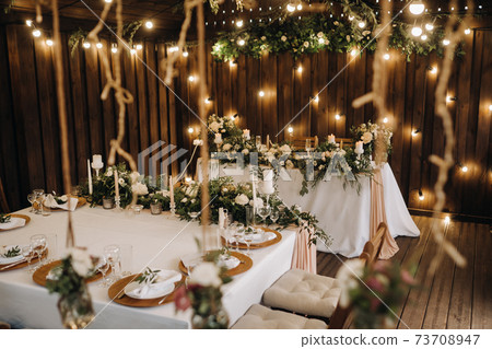 wedding table decoration with flowers on the table, candlelit dinner table decor. 73708947