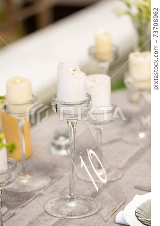 wedding table decoration with flowers on the table in the castle, table decor for dinner by candlelight.Dinner with candles 73708962