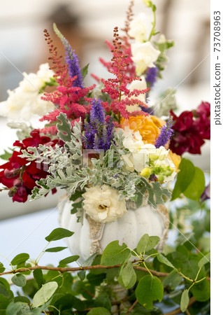 wedding table decoration with flowers on the table in the castle, table decor for dinner by candlelight.Dinner with candles 73708963