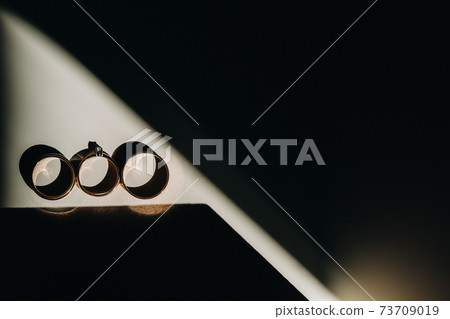 Close-up of two gold wedding rings for a wedding 73709019