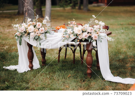 wedding table decoration with flowers on the table, dinner table decor 73709023