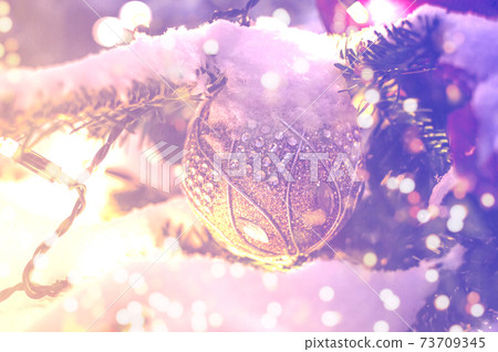 Christmas balls on Christmas tree branch, soft focus 73709345