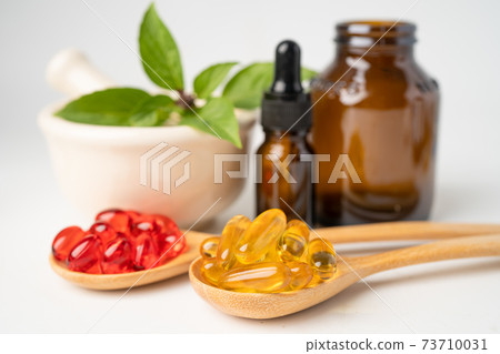 Alternative medicine herbal organic capsule with vitamin E omega 3 fish oil, mineral, drug with herbs leaf natural supplements for healthy good life. 73710031