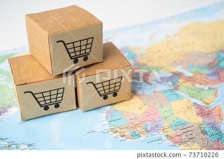 Shopping cart logo on box on world globe map background. Banking Account, Investment Analytic research data economy, trading, Business import export transportation online company concept. 73710226