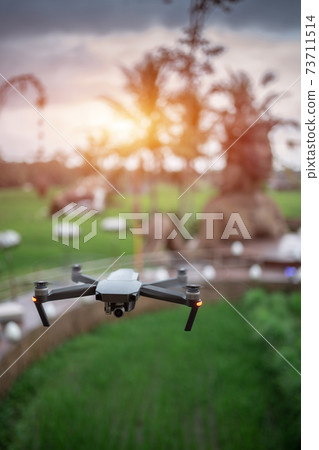professional drone flying over ancient stone idol monument professional drone flying over ancient stone idol monument 73711514