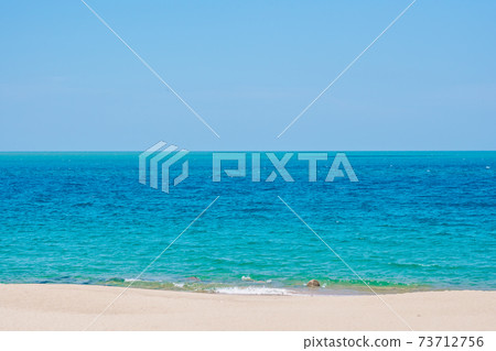 Deep blue turquoise lazur empty sea panorama skyline under clear sky summer sunshine clean sand, paradise calm design wallpaper background. Tropical holiday end of quarantine Covid isolation Deep blue turquoise lazur empty sea panorama skyline under clear sky summer sunshine clean sand, paradise calm design wallpaper background. Tropical holiday end of quarantine Covid isolation 73712756