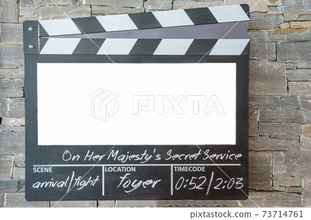 Blank mock up of clapper board,Movie clapper with copy space for your text message or content onstone wall background 73714761